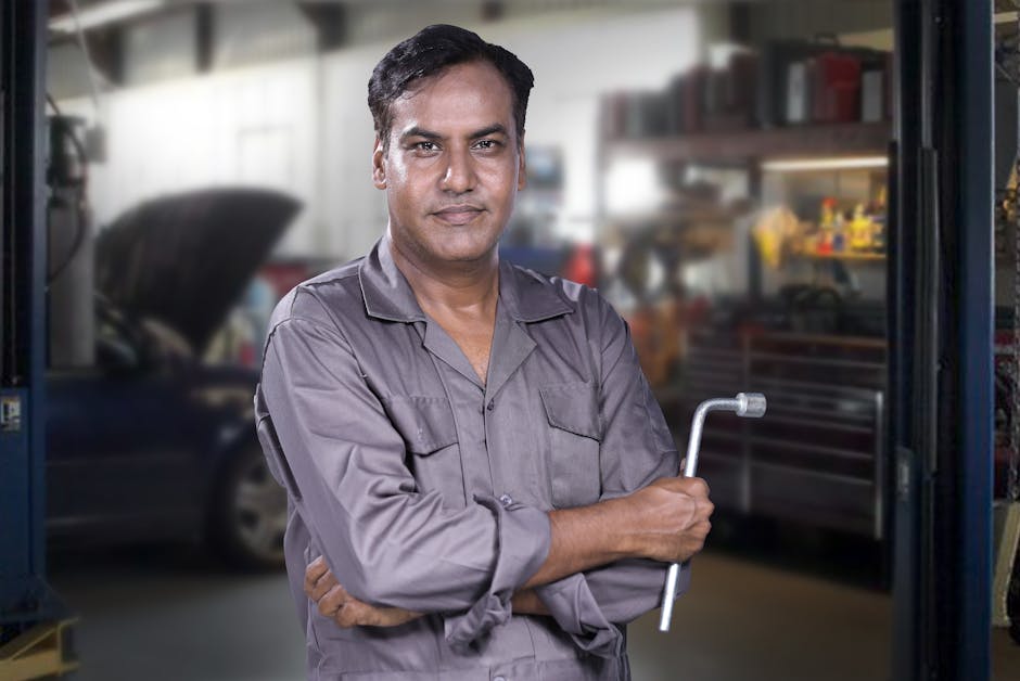 Friendly automotive mechanic ready to assist with tire services