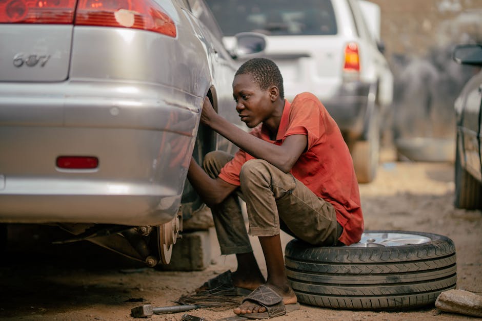 Mechanic performing a professional tire installation on a vehicle